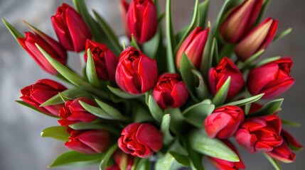 Naklejka premium Close up of a bunch of red tulips Spring blooms to celebrate a special occasion