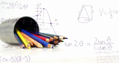 Image of mathematical equations floating over colored pencils against white background