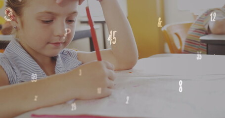 Image of changing numbers and multiple symbols, caucasian girl writing in book