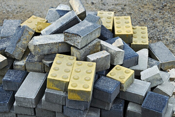 Stack of paving stone and tactile tiles