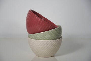 Modern kitchen supplies, red, green, and beige bowls