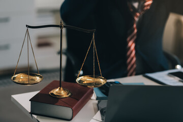 Male lawyer working with contract papers and wooden gavel on tabel in courtroom. justice and law ,attorney, court judge, concept.