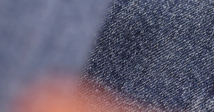 blue soft denim fabric for sewing clothes, details of clothes made of blue denim soft fabric