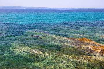 Scenic Aegean Sea waters view from the cape of Vourvourou Karydi Beach, Sithonia, Chalkidiki peninsula, Central Macedonia, Northern Greece