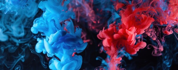 Fototapeta premium A mesmerizing abstract image featuring blue and red acrylic colors swirling and blending in water. The vibrant and dynamic patterns create a visually striking composition.