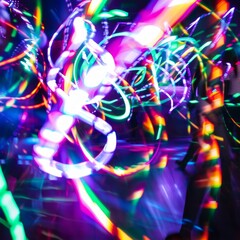 A blurry image of people dancing with neon lights