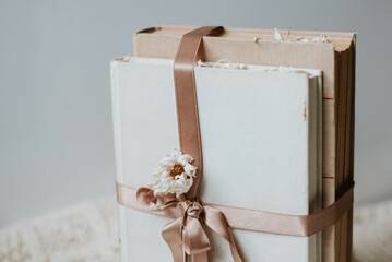 two vintage books with a beautiful satin ribbon and dried flowers