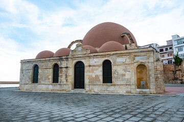 Mosque in the old Venetian harbor of Chania town on Crete island, Greece.