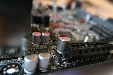 High technology electronic. Micro electronic on the board. Focused on capacitors.