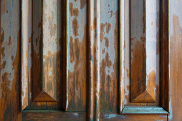 texture of a wooden door partially wet from rain