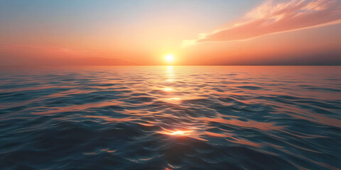 A sunrise over a calm ocean.


