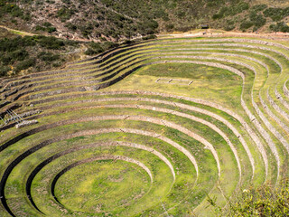 Ancient Incan crop fields in terraced circles found in Sacred Valley, Peru.