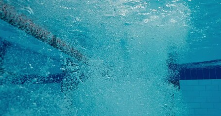 Underwater, dive and male athlete for pool exercise, training and cardio for practice. Stroke, professional or start for competition or splash with movement, sports or workout for health and wellness