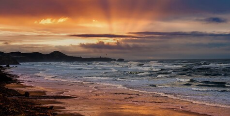 Yaquina Head lighthouse at sunset near Newport Oregon on the Oregon coasat.