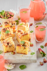 Homemade rhubarb yeast cake served as dessert in summer.