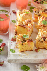 Sweet rhubarb yeast cake served as dessert in summer.