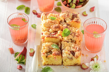 Sweet and yummy rhubarb yeast cake with sugar and crumble.
