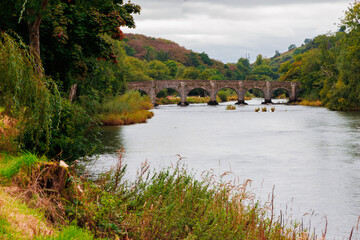 bridge spanning a river in a scenic landscape