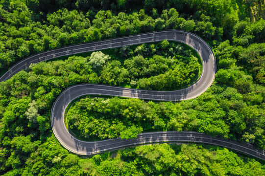 Aerial summer view of a winding mountain road forming an S-shape