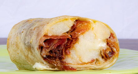 bacon egg and cheese Burrito close up 