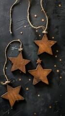 Wooden stars on black background. Christmas decoration 