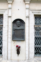Memorial plaque in a house on Svetlanskaya street 52 in Vladivostok (Russia) with a portrait of the...