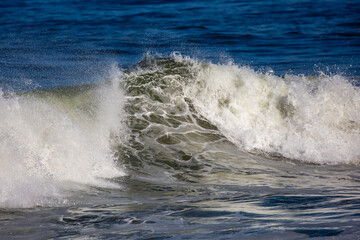 Pacific ocean wave breaking in summer