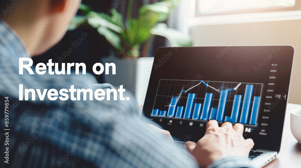 Poster a business professional reviews investment performance on a laptop, with a graph showing positive re