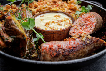 Fried sausages with spices and fried potatoes