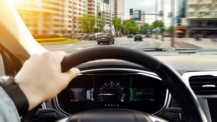 Man driving car with one hand on steering wheel, closeup. Banner design
