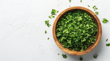 Dried parsley in wood bowl on white background with copy space