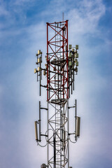 tower cellular antenna, against the blue sky in the morning
