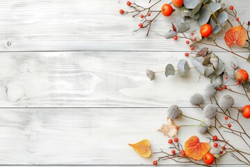 Autumn berries and leaves on white wooden background, copy space, autumn concept