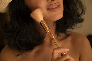 Makeup artist with brushes in hand 