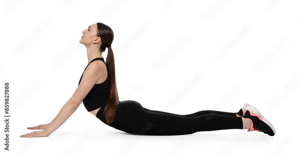 Wall mural Aerobics. Young woman doing stretching exercise on white background