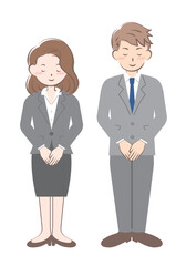お辞儀をするスーツ姿の男女　全身