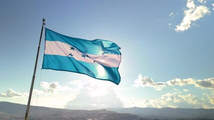Flag of Honduras with the sun in the background in a sunset - Powered by Adobe