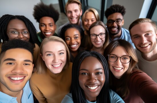 Diverse group of young professionals smiling and taking a selfie in an office setting, symbolizing employee community and team building.Labor Day, part-time, happy, hard-working, active