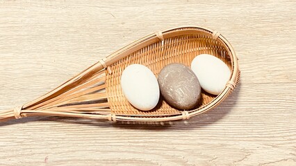 Eggs in a woven rattan container 