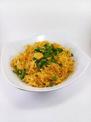 Bihun Goreng, Indonesian Noodle Dish in a White Cup on a Crisp White Background