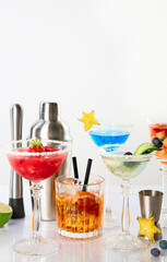 Summer cocktails in classic glasses on a white background. Party time