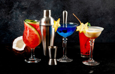 Summer cocktail in glasses on a dark background. Bar delicious drinks