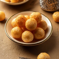 Salty cheese puffs or balls snack