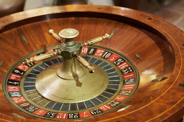 old wooden roulette wheel in a casino