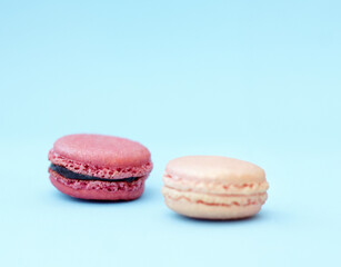 Cookies, candy and display of macaroons with variety, delicacy and treats on blue background. Baked dessert, French sweets and different flavors of confectionery for bakery, fine dining and luxury