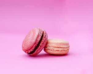 Macaroons, luxury and display of French sweets with variety, delicacy and treats on pink background. Baked candy, dessert and different flavors of confectionery for bakery, fine dining and cookies