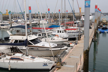 Big and small yachts anchored in the port

