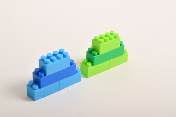 Naklejka premium Plastic toy blocks isolated on white background. Building Blocks