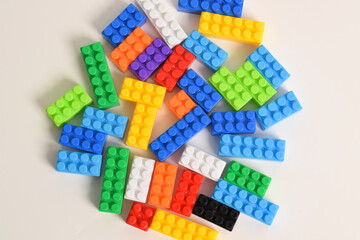 Pile of Colorful Plastic toy blocks isolated on white background