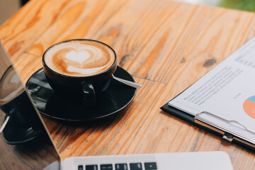 Closeup of coffee cup on table in empty corporate conference room before business meeting in office